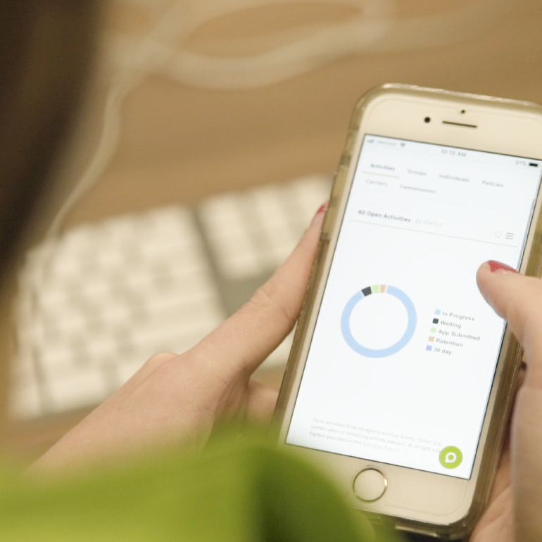 Phone displaying AgencyBloc app