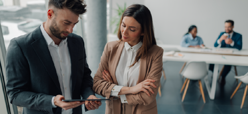 Man and woman looking at an ipad