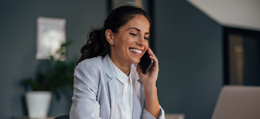 Smiling professional insurance agent helping her client with paperwork