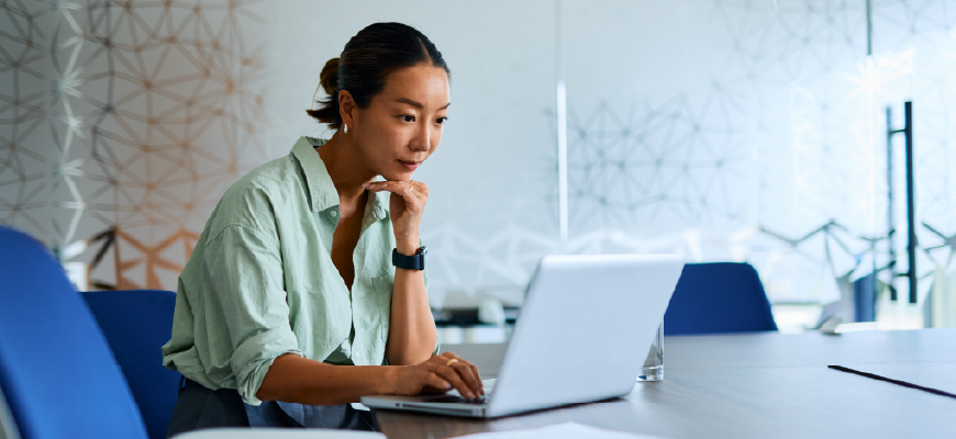 Insurance agent typing on their computer