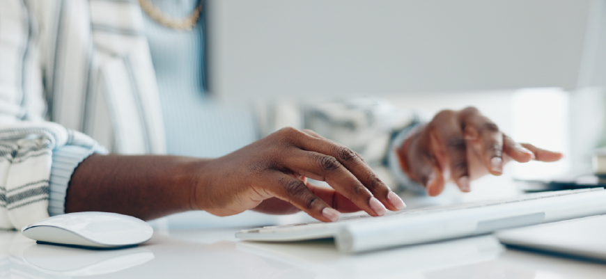 Hands typing on keyboard