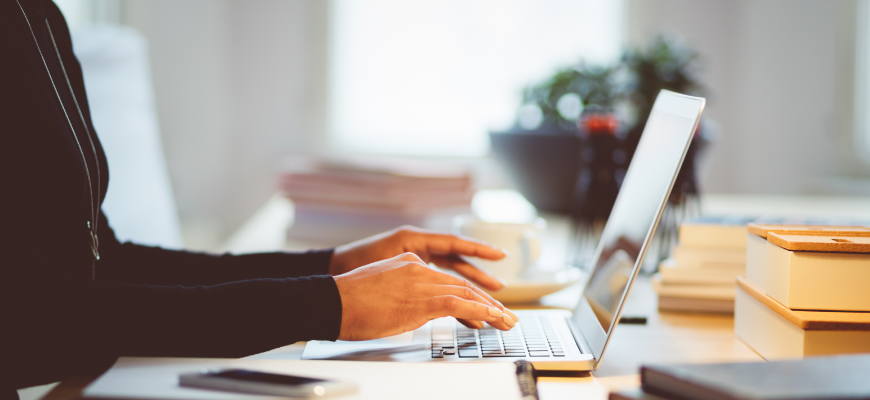 Person typing on laptop computer