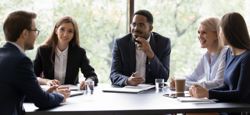 Insurance agent meeting with group client to discuss compliance