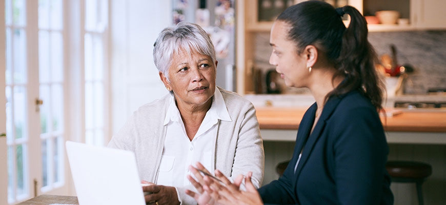 Insurance agent meeting with senior client