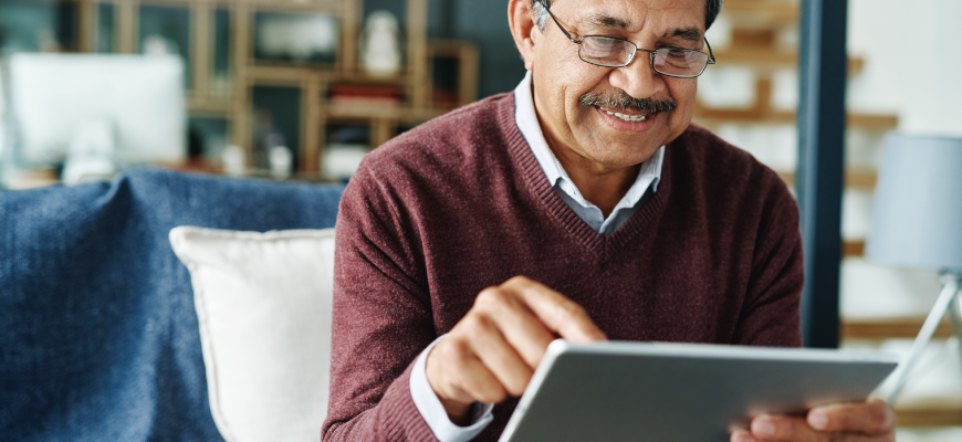 Senior man using iPad