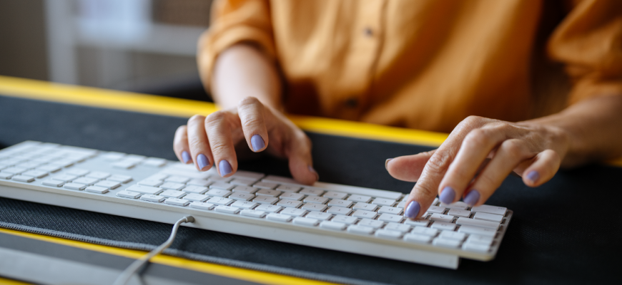 Insurance agent typing on their computer
