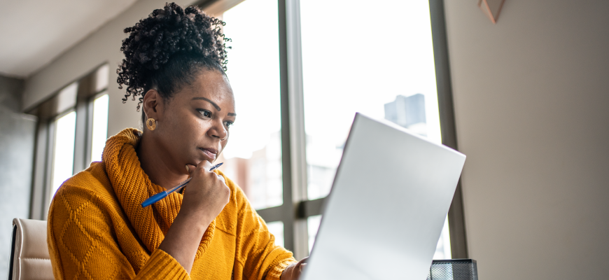 Insurance agent working on insurance website for enrollment season